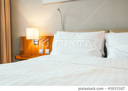 White pillow on bed decoration in bedroom interior 45055387