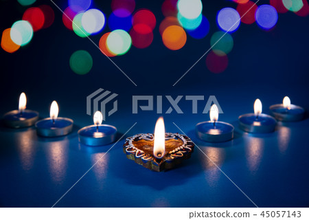 Happy Diwali - Clay Diya lamps lit during Dipavali 45057143
