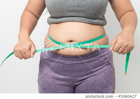 Overweight woman check out his body fat  45060427