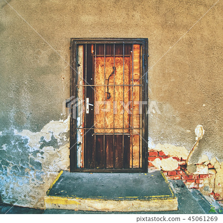 Walled door entry of abandoned house. 45061269