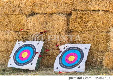 Two archery targets on a straw background Two archery targets on a straw background 45061407