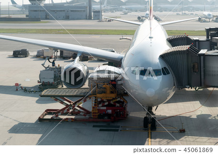 Loading cargo on plane in airport before flight. Loading cargo on plane in airport before flight. 45061869