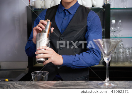 bartender making cocktail bartender making cocktail 45062371