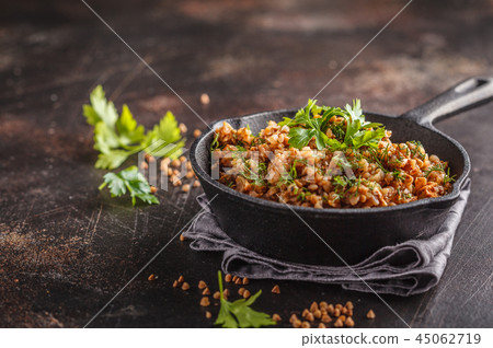 Buckwheat with meat in a cast iron pan  45062719
