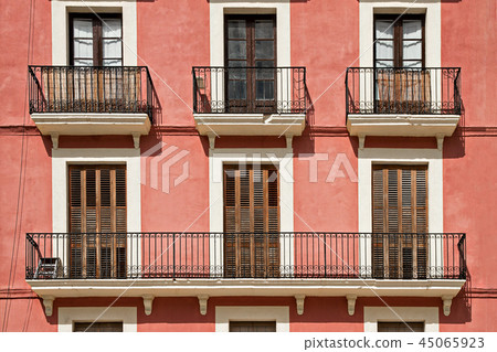 Typical building facade with balconies in Tarragona, Spain 45065923