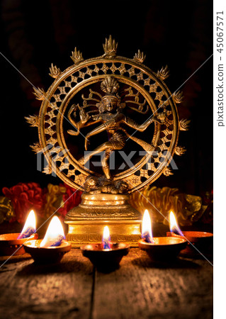 Dancing lord Shiva statue, Nataraja against black background Stock Photo -  Alamy