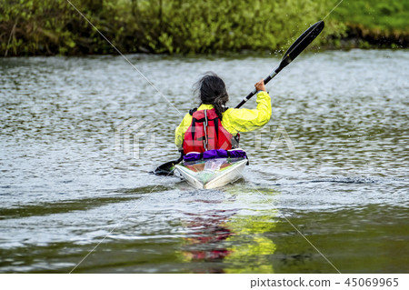Kayak racing on the lake in Wales Kayak racing on the lake in Wales 45069965