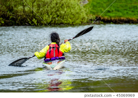 Kayak racing on the lake in Wales Kayak racing on the lake in Wales 45069969