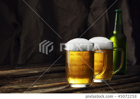 Glass of beer on a dark background Glass of beer on a dark background 45072258