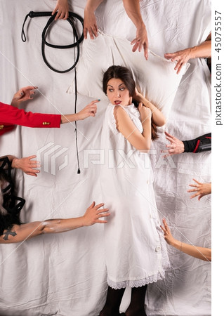 Sexy frightened girl lying in bed high angle shot 45075557