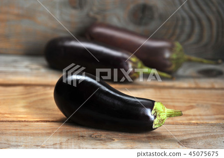 fresh eggplant on rustic background 45075675