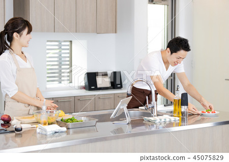 Lifestyle couple cooking Lifestyle couple cooking 45075829