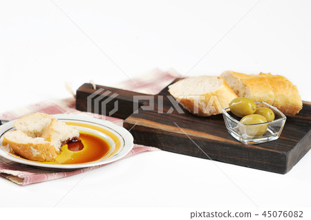 olives, baguette and olive oil 45076082
