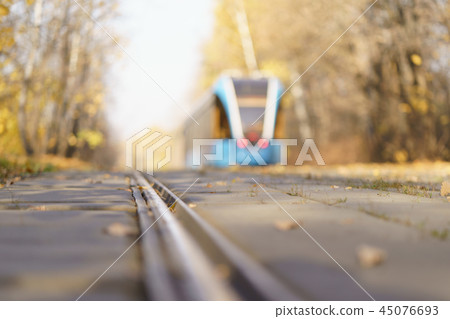 Tram at the city street at the sunny autumn day Tram at the city street at the sunny autumn day 45076693