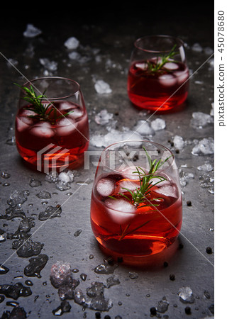 Pomegranate cocktail on the black concrete Pomegranate cocktail on the black concrete 45078680