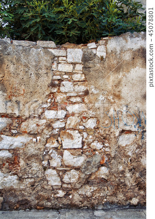 Ancient stone wall in old town Ancient stone wall in old town 45078801