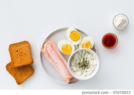 Healthy breakfast. Boiled eggs, ham and cheese 45078831