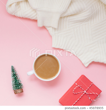 Coffee sweater and red present pink background 45078935