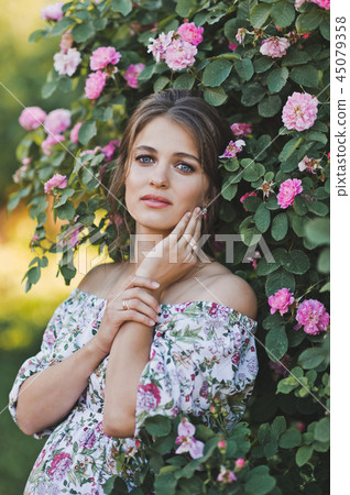 A large portrait of a beautiful girl light dress 45079358