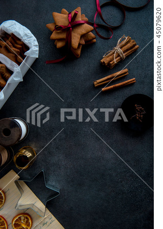 Gift wrapping of star shaped gingerbread cookies. 45079620