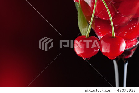 Cherries in a martini glass 45079935