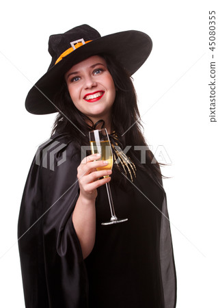 Photo of witty brunette in black hat with glass of champagne Photo of witty brunette in black hat with glass of champagne 45080355