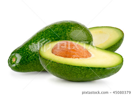 Avocado and two halves close-up on a white Avocado and two halves close-up on a white 45080379
