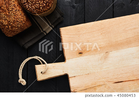 Chopping board and various whole wheat bread Chopping board and various whole wheat bread 45080453