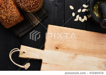 Chopping board and various whole wheat bread Chopping board and various whole wheat bread 45080459