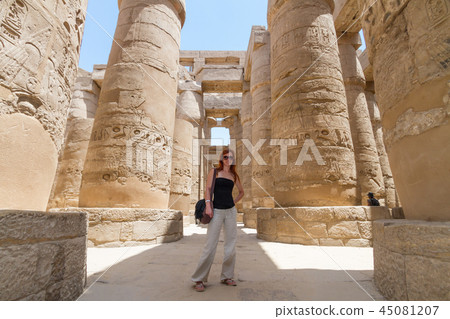 Female Tourist at Temples of Karnak, ancient Thebes in Luxor, Egypt Female Tourist at Temples of Karnak, ancient Thebes in Luxor, Egypt 45081207