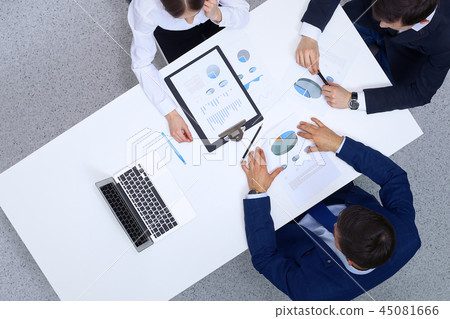 Group of business people analyzing financial documents, view from above. Business team at meeting 45081666