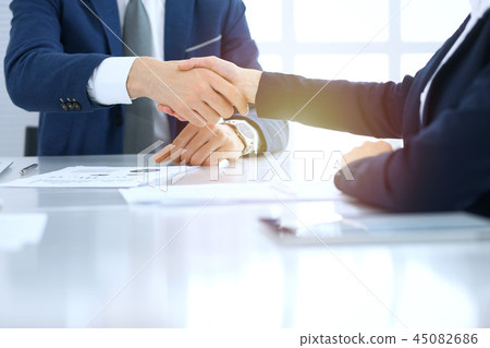 Group of business people or lawyers shaking hands finishing up a meeting , close-up. Success at Group of business people or lawyers shaking hands finishing up a meeting , close-up. Success at 45082686