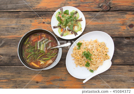 Thai cusine menu from top view on wood table Thai cusine menu from top view on wood table 45084372