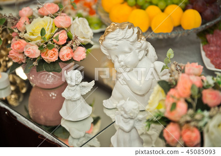 Angel figurine on the holiday table 1601. 45085093