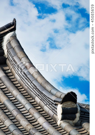 Korean traditional tile and silhouette in the background of a clear blue sky 45085659