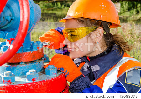 Woman worker in the oilfield Woman worker in the oilfield 45088373
