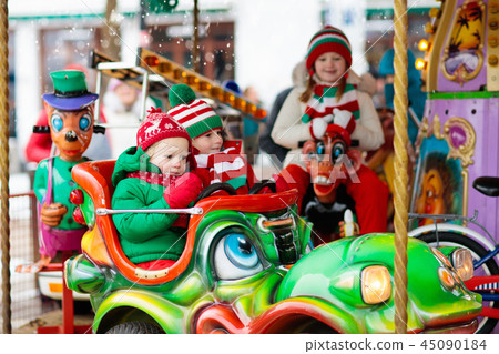 Kids at Christmas fair. Child at Xmas market. Kids at Christmas fair. Child at Xmas market. 45090184