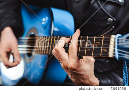 the guy plays guitar 45091066