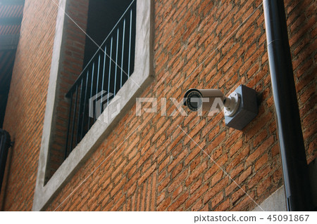CCTV security camera with brick building CCTV security camera with brick building 45091867