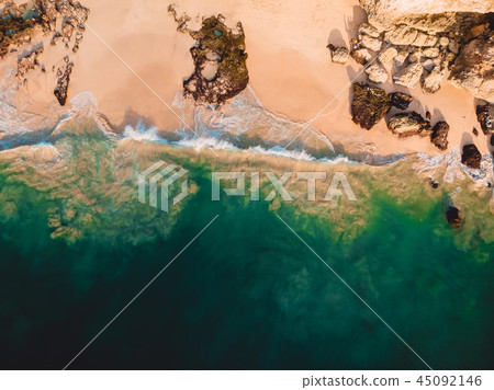 Aerial view of ocean waves at sandy beach. Aerial view of ocean waves at sandy beach. 45092146