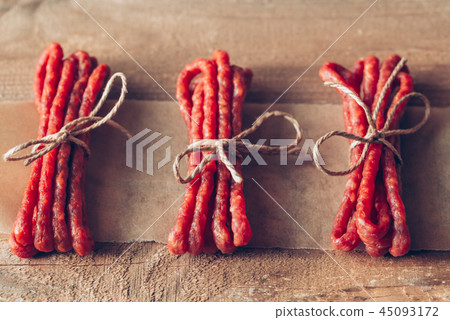 Kabanosy sausages on the wooden background 45093172