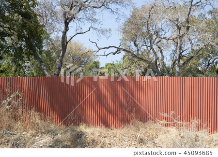 Red metal fence 45093685