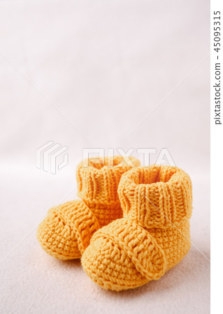 Newborn announcement. knitted baby booties Newborn announcement. knitted baby booties 45095315