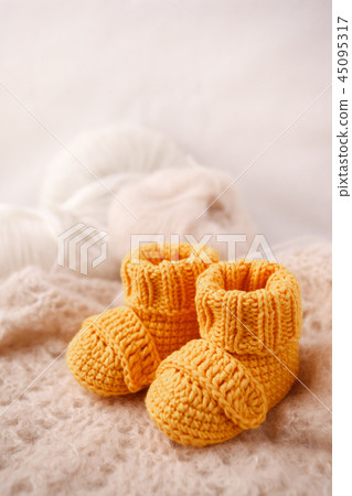Newborn announcement. knitted baby booties Newborn announcement. knitted baby booties 45095317