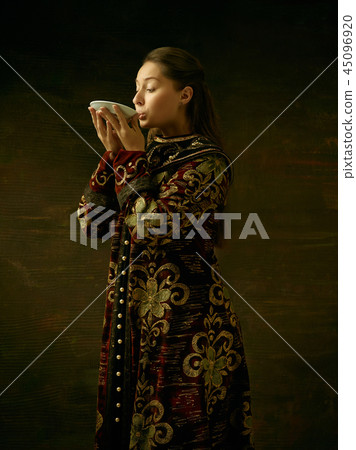 Girl standing in Russian traditional costume. Girl standing in Russian traditional costume. 45096920