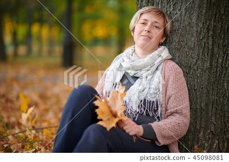 Woman with yellow leaves is in autumn city park - Stock Photo [45098081 ...