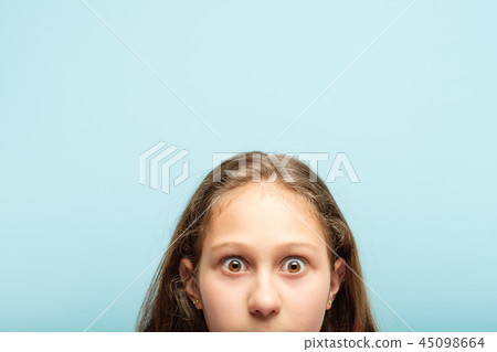 startled surprised shocked girl peeking out bottom 45098664