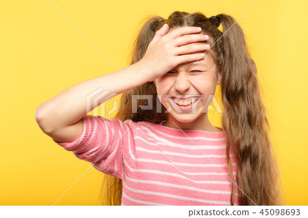 ashamed smiling girl cover forehead hand embarrass ashamed smiling girl cover forehead hand embarrass 45098693