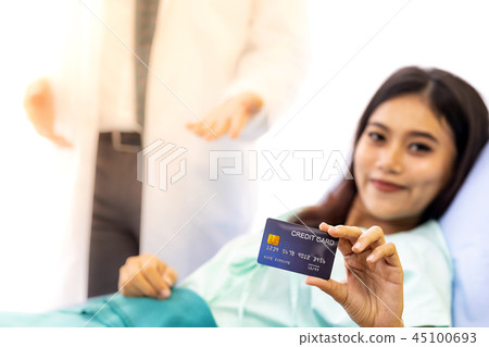 Patient with credit card for insurance concept 45100693