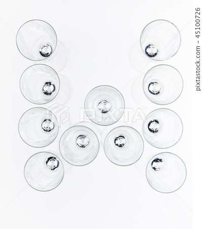 alphabet Empty champagne glass white background alphabet Empty champagne glass white background 45100726